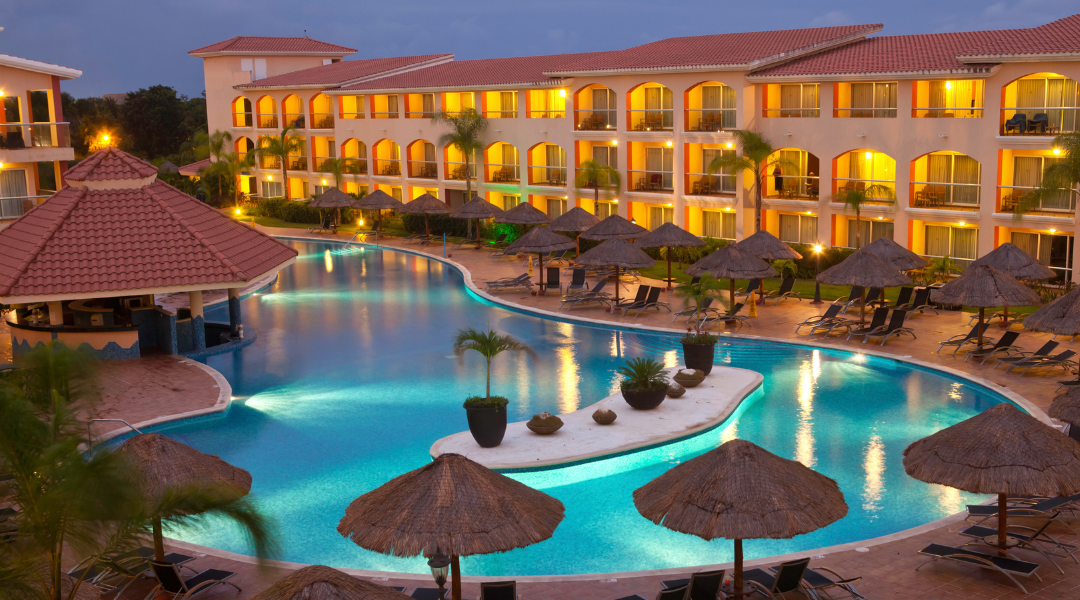 Aerial view of luxury beachfront resort property at twilight